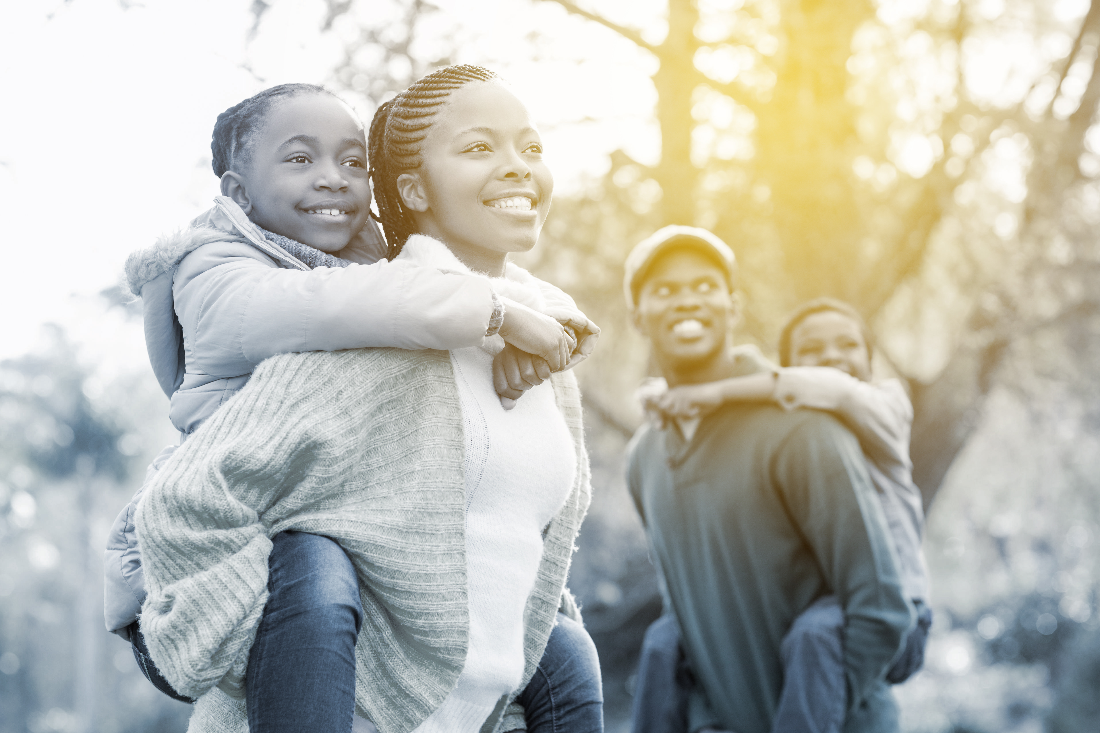 46685243 - portrait of a young smiling family in piggyback on an autumns day